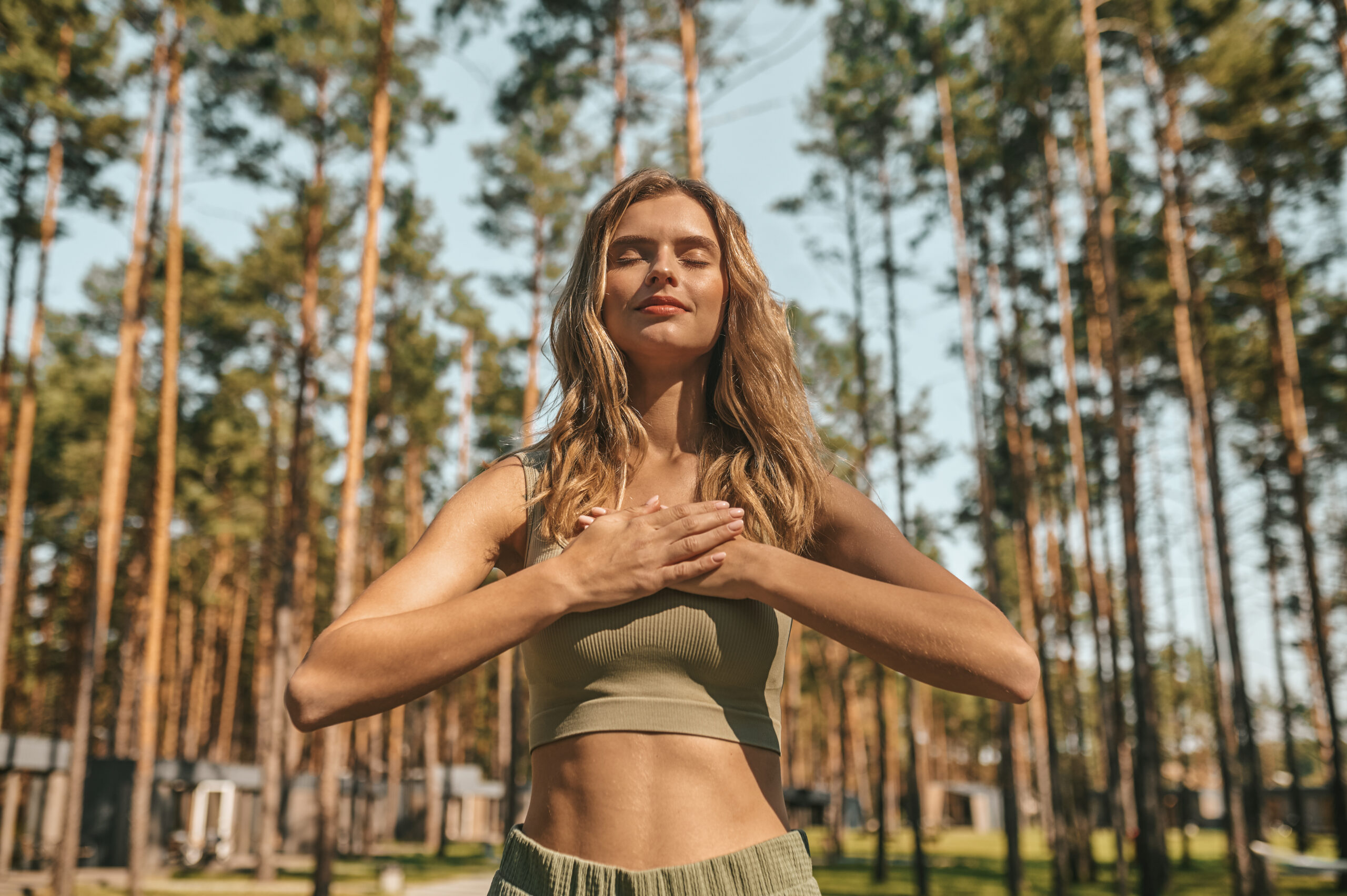 Cute Blonde Woman Practising Yoga Outside Looking Relaxed Scaled