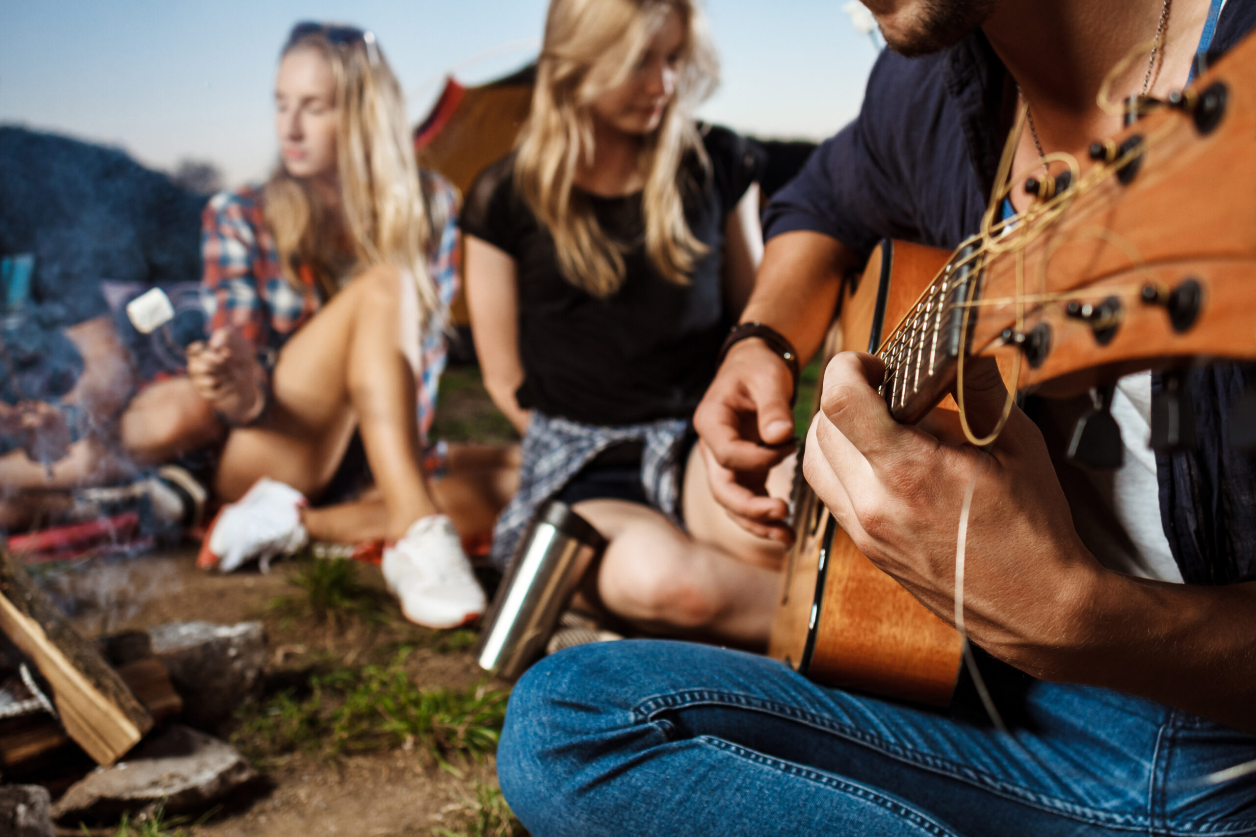 Friends Sitting Near Bonfire Smiling Playing Guitar Camping Grill Marshmallow Scaled