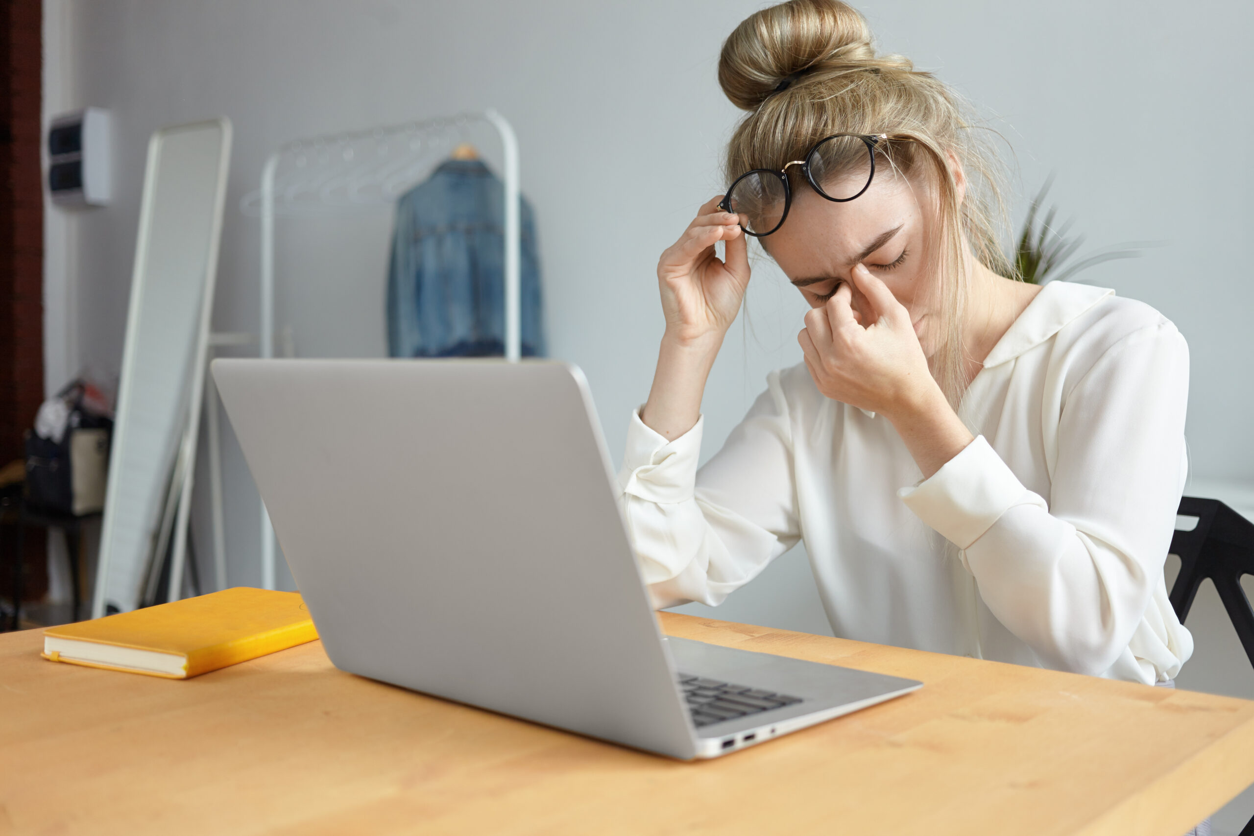 Modern Technology Job People Concept Portrait Tired Young Female Employee With Hair Bun Taking Off Eyeglasses Massaging Her Nose Bridge Feeling Stressed Because Lot Work Scaled