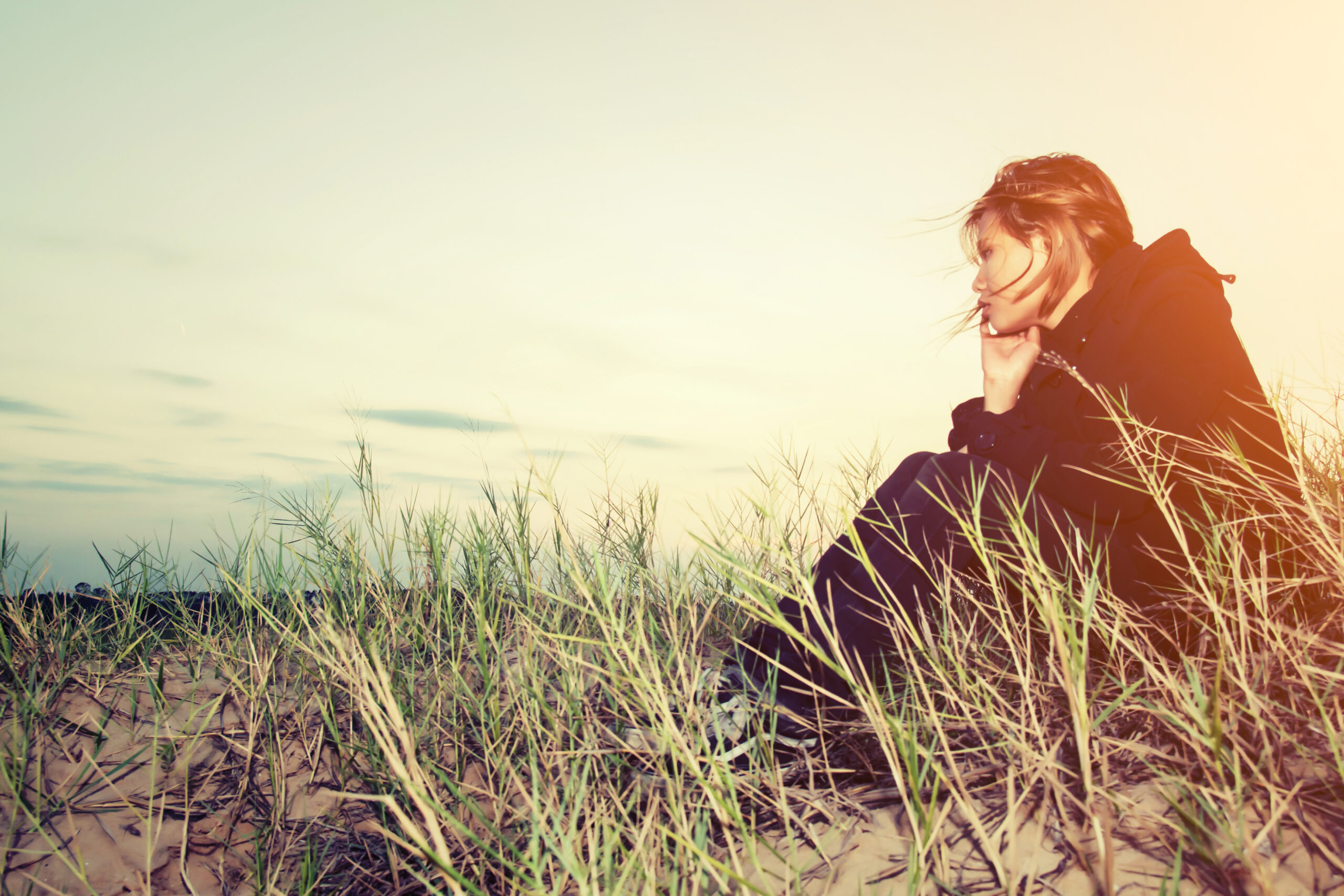 Worried Girl Sitting Sand Scaled