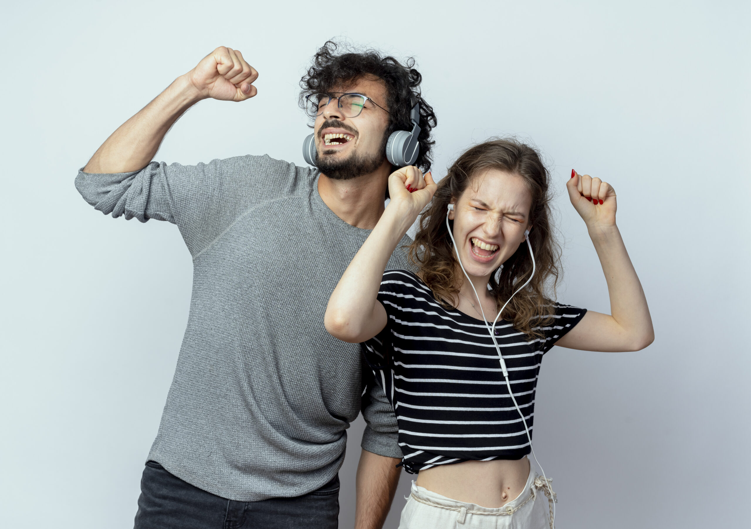 Young Beautiful Couple Man Woman With Headphones Enjoying Music Dancing Standing White Wall Scaled