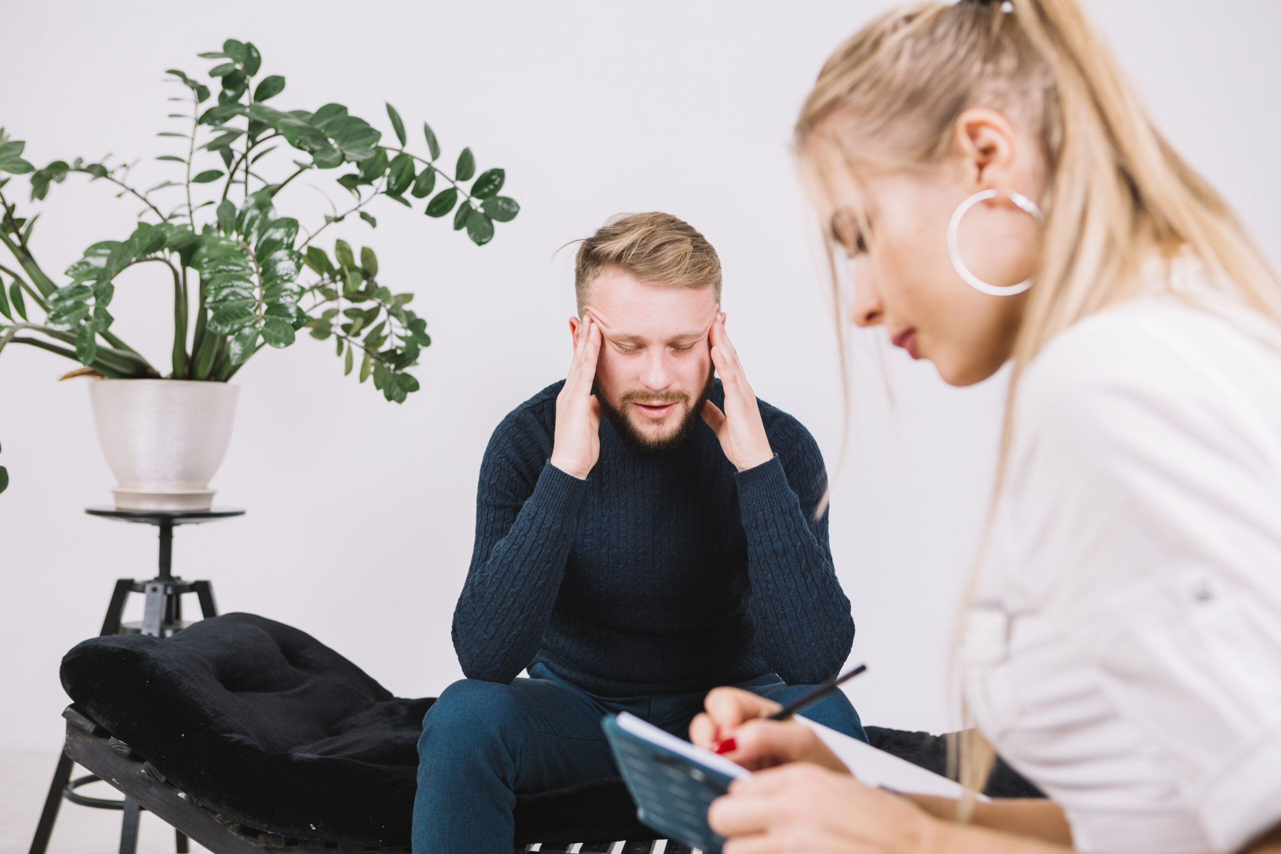 Young Female Psychologist Is Writing Down Her Thoughts About Depressed Patient Scaled